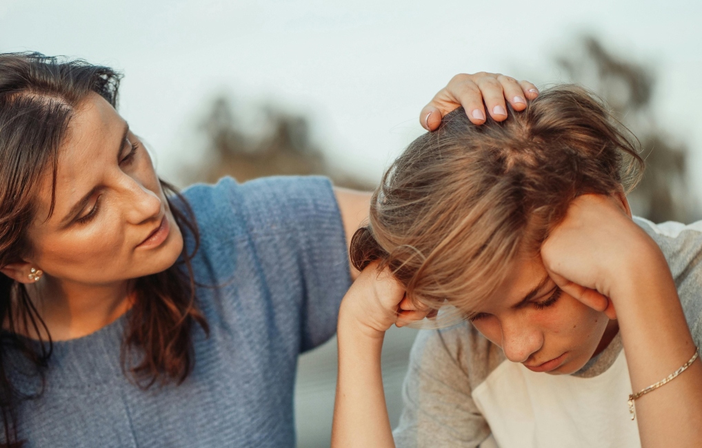 Woman comforting an upset child