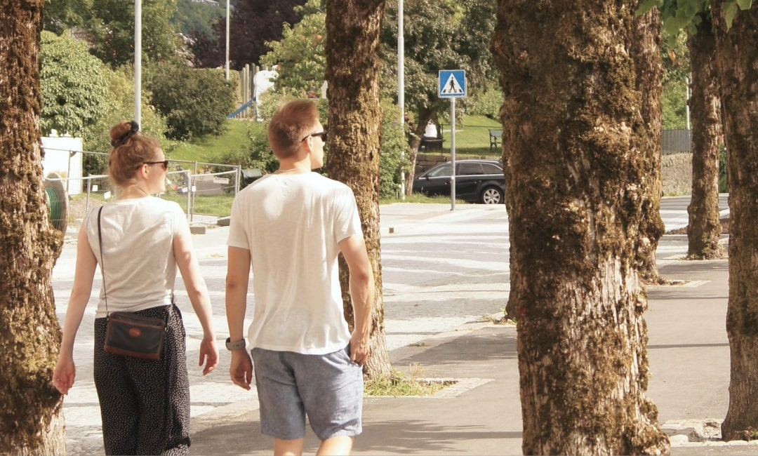 Couple walking along a suburban street