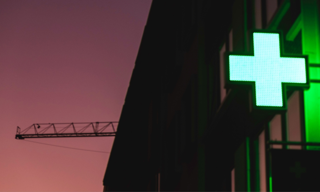 Pharmacy light on at dusk
